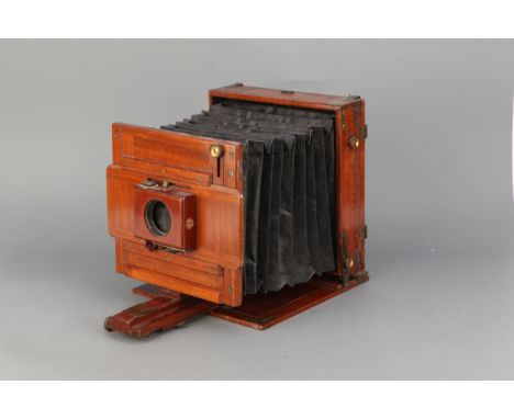 A W. W. Rouch 'Rouch's Patent' Whole Plate Mahogany Field Camera, serial no. 1111, with roller-blind shutter, lacking lens, w