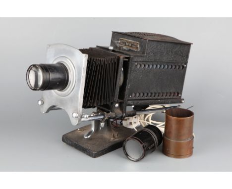 An Ensign Optiscope No.9 Projector, with Aldis-Butcher 8 inch projection lens, together with a box containing accessories (a 