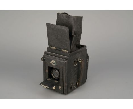 A Thornton Pickard Victory Reflex Camera, with Cooke Anastigmat f/4.5 5¾" lens, lacking shutter leverImport Duty These items 