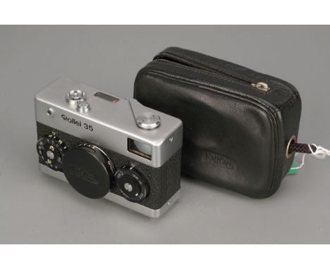 A Rollei 35 Camera, with Carl Zeiss Tessar f/3.5 40mm lens, with maker's cap and caseImport Duty These items have been brough