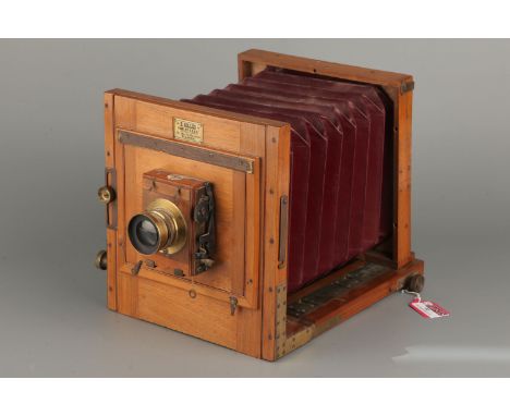 An E. Gilles French Half Plate Mahogany Tailboard Camera, with unmarked f/8 brass lensImport Duty These items have been broug