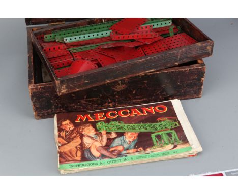 A Large Case of Meccano &amp; a Rag Book,&nbsp;  Meccano C. 1950's including  gears, worms, wheels, tyres etc, with instructi