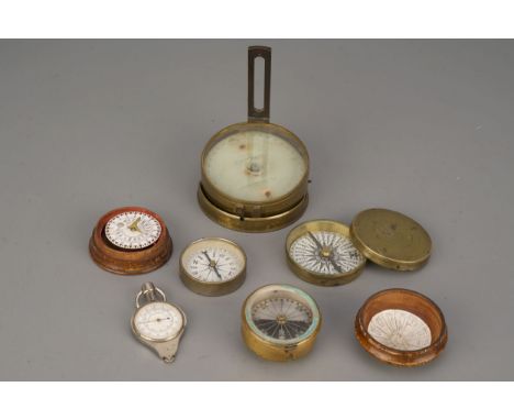 A Porter Compass Sundial etc. with a Singer patent compass, three other magnetic compasses and an opisometer