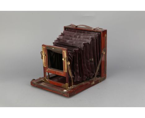 An A &amp; N Auxiliary C.S. Ltd 'The Society' Half Plate Mahogany Field Camera, lacking lens board and ground glass screen (A