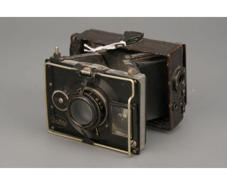 An ICA Bebe Klapp-Camera, with Carl Zeiss Jena Triotar f/3.5 75mm lens, complete with empty magazine backImport Duty These it