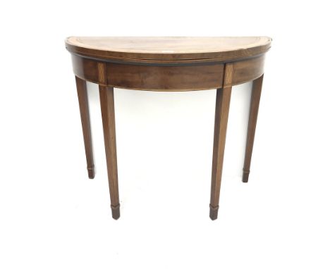 George III inlaid and cross banded mahogany demi-lune card table, folding top enclosing green baize, square tapering supports