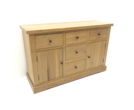 Light oak sideboard, five drawers, two cupboards, plinth base, W143cm, H91cm, D48cm - Condition Report 
