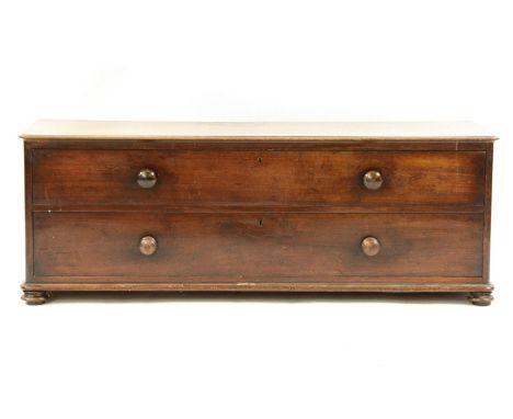A Victorian mahogany low chest/bench, rectangular top, above two drawers squat bun feet, 130 x 46 x 47 cm