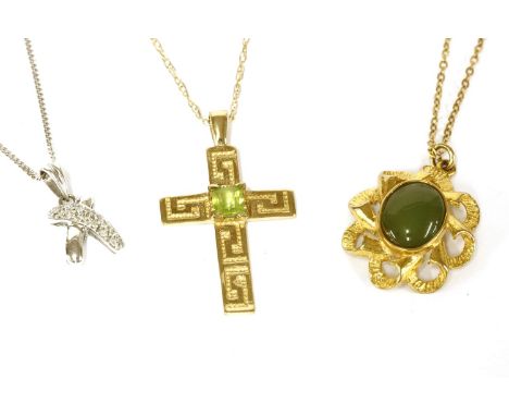 A white gold diamond set cross over pendant on chain, a 9ct gold cross with Greek key decoration and peridot to centre on cha