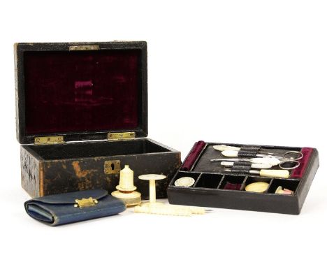A 19th century sewing box, with a number of bone tools