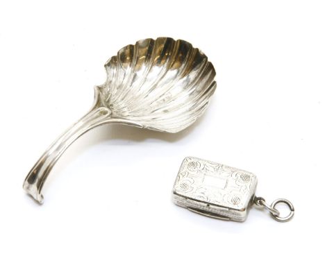 A Georgian silver shell caddy spoon, by Henry Tudor & Thomas Leader, Sheffield, 1791 (?), and a small silver vinaigrette, by 