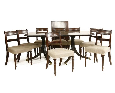 A reproduction twin pillar dining table, complete with one leaf, 102cm wide, 229cm long, 74cm high, together with a set of ei