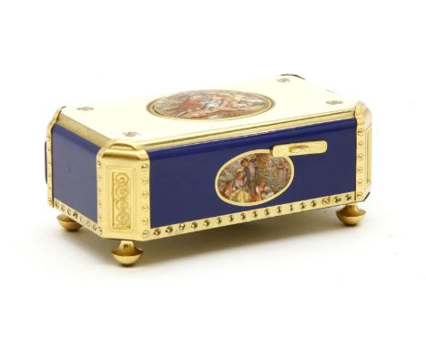 A Swiss Reuge automaton music box, the oval hinged lid opening to reveal a dancing and tweeting bird, with pierced gilt grill