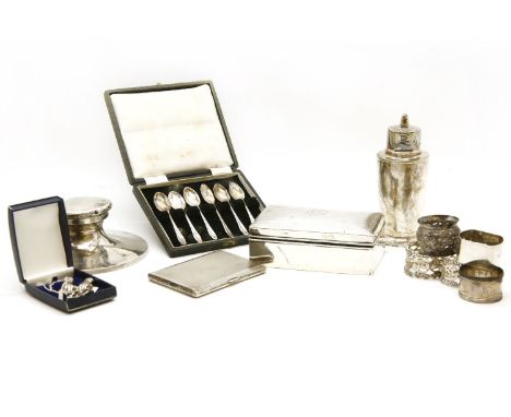 Silver items: sugar shaker, cigarette box, case and vesta, inkwell, 5 napkin rings, set of 6 cased coffee spoons and two mode