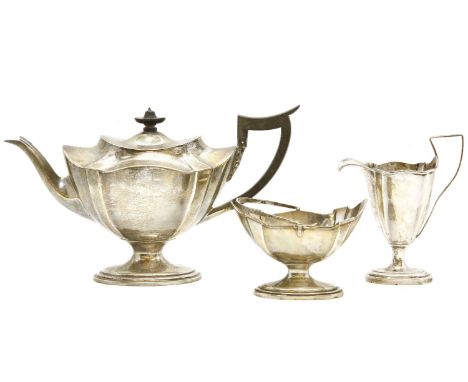 A silver matched three piece tea set, Mappin & Webb, Sheffield 1912, and Birmingham 1916? teapot 18.5cm