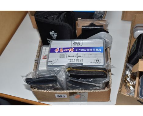 A BOX OF LOCKSMITH'S TOOLS to include two HUK multifunctional inverters, a SouthOrd practice handcuff with picks, two pouches