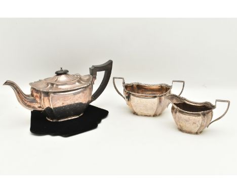 A GEORGE V SILVER THREE PIECE TEA SET, comprising of teapot, sugar bowl and milk jug, each piece with foliate pattern rim, te