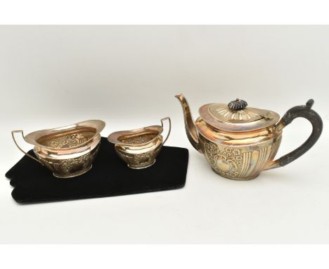 A LATE VICOTORIAN SILVER THREE PIECE TEA SET, comprising of a teapot, sugar bowl (broken handle) and cream jug, hallmarked 'T