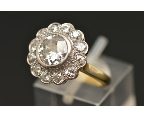 AN 18CT GOLD DIAMOND CLUSTER RING, collet set with a central old cut diamond, spreads approximately 1.50ct, clarity assessed 
