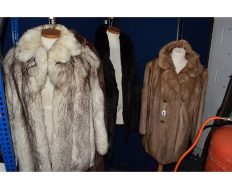 A GROUP OF FOUR LADIES' VINTAGE FUR COATS, comprising an Arctic fox fur, a caramel coloured mink fur with pearlized buttons, 