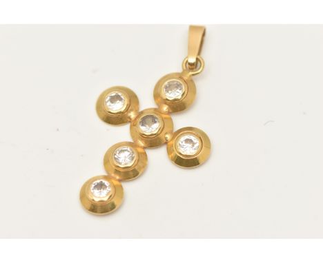 A YELLOW METAL CUBIC ZIRCONIA CROSS PENDANT, set with six circular cut cubic zirconia stones, fitted with a tapered bail, sta