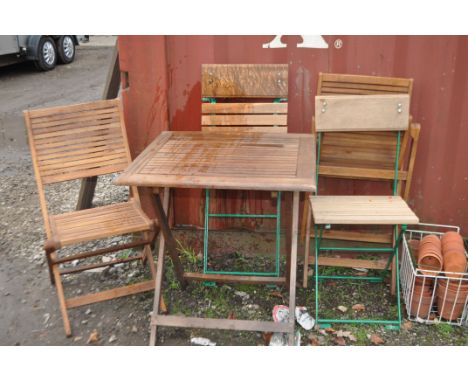 A SELECTION OF FOLDING HARDWOOD GARDEN FURNITURE including a folding table with two matching chairs and a pair of steel frame