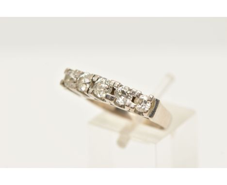 A WHITE METAL FIVE STONE DIAMOND RING, designed as a row of five slightly graduating old cut diamonds, each in a shared claw 