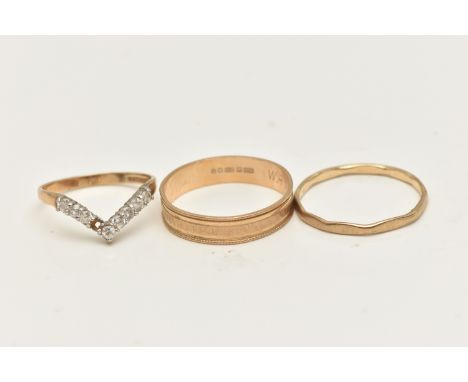THREE 9CT GOLD RINGS, to include a textured band ring, hallmarked 9ct London, ring size T, a 9ct gold cubic zirconia set wish
