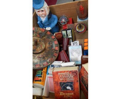 A good lot of old games including tin plate, playing cards, music box etc