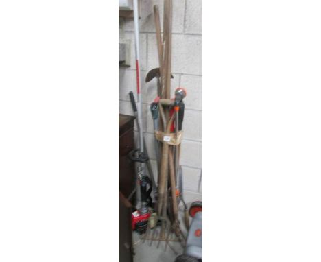 A quantity of garden tools including strimmer
