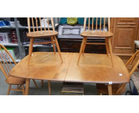 An Ercol dining table and 4 chairs