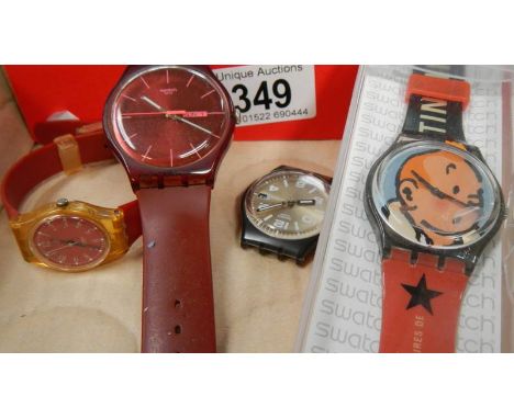 A Swatch Tin Tin watch in box, 2 other Swatch watches and a Swatch watch head