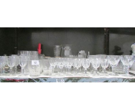 A shelf of drinking glasses