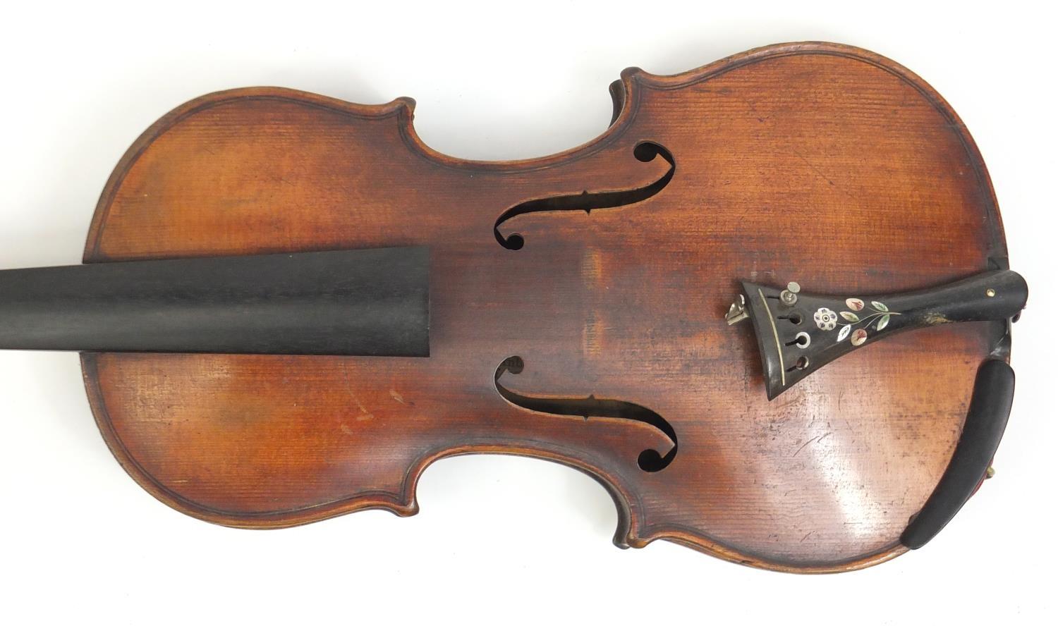 Old wooden violin, with scrolled neck and inlaid horn Tailpiece