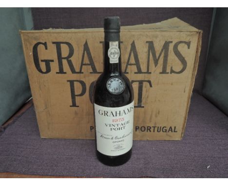 Eight bottles of Graham's 1975 Vintage Port, no strength of capacity on label, in card box