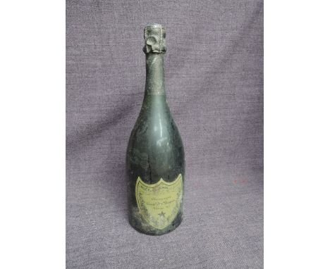 A bottle of Moet Chandon Champagne Cuvee Dom Perignon Vintage 1975, no strength or capacity stated to label, 75cl impressed t