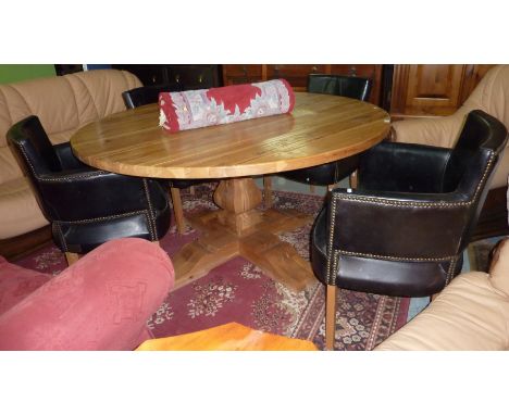 Quality light oak pegged circular dining table on single pedestal and a set of 4 leather upholstered armchairs on lightwood s