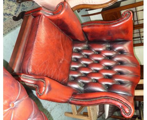 Red leather deep button back wingback armchair