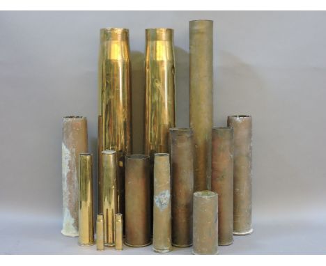 A pair of World War II brass 37in gun shell casings, twelve other assorted brass shell casings, smallest 11cm, tallest 69.7cm