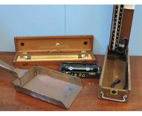 A W H Harling Ltd lacquered brass and beech slide rule, an M & W engineer's level, a copper coin shovel, a blood pressure gau