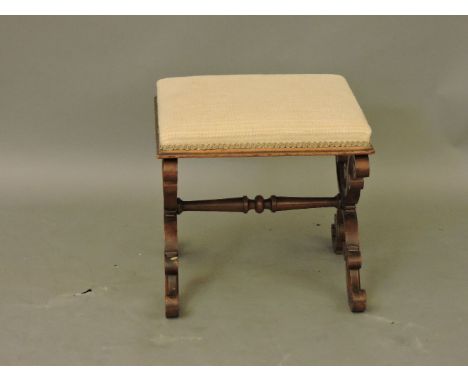 A Victorian carved walnut X framed stool, 44cm tall, Provenance: from a prominent Hertfordshire country house