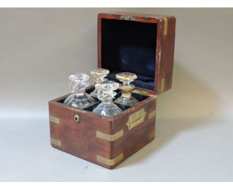 A brass bound mahogany decanter box, with two pairs of decanters and stoppers, 21.5cm wide
