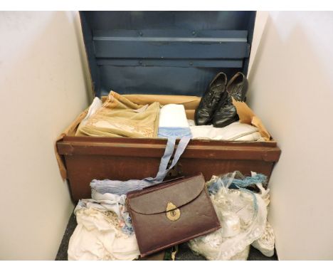 A tin trunk, containing costumes, shoes, damask table linen, etc