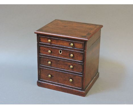 A mahogany tea caddy, in the form of a Georgian chest of drawers, with a hinged cover, and internal cover, 11cm wide
