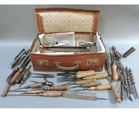 A case of old tools, and two oil cans