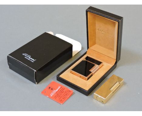 An S T Dupont lighter, with black Chinese lacquered sides, cased with certificate, and a Dunhill lighter