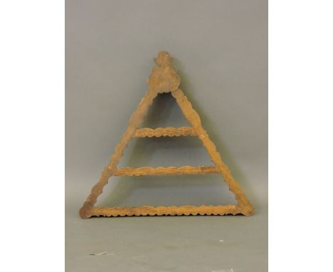 A triangular grained pine wall shelf, 72cm high, and a triangular cribbage board, 21cm high