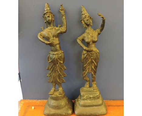 A pair of 20th century Oriental bronze dancing figures, one male, one female, on stepped bases, 49cm