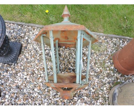 A hexagonal metal lantern, with an arrow finial, 82cm high