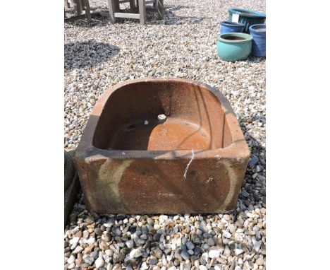 A salt glazed D shaped pump trough, 47 x 554cm